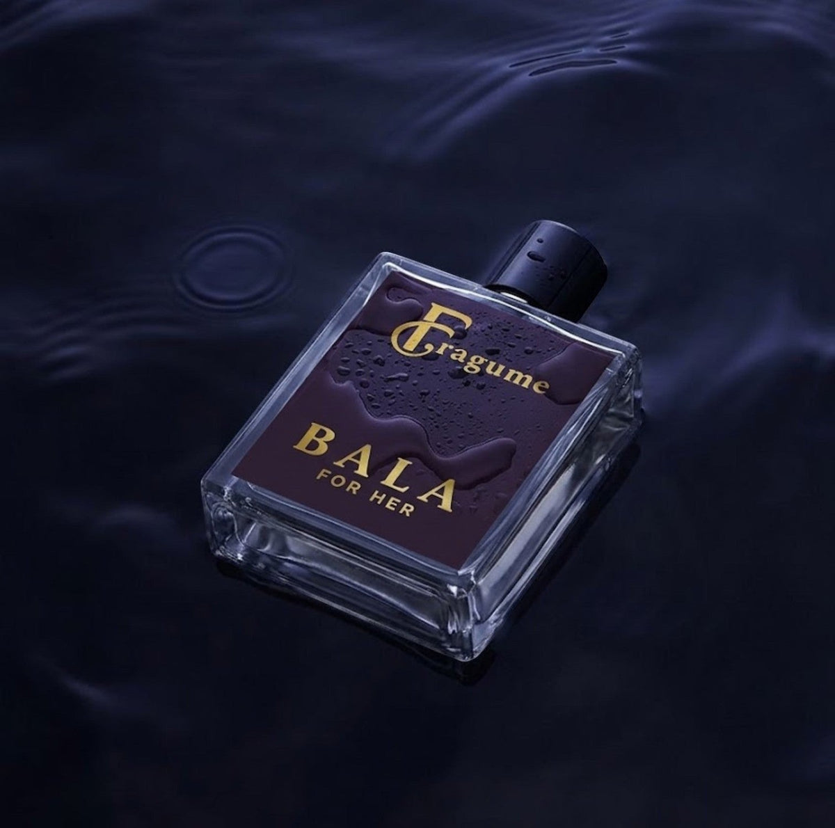 Fragume Bala Eau De Parfum in a sleek purple glass bottle with gold lettering, resting in dark rippling water.