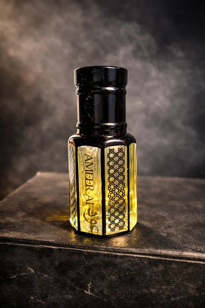 fragume Ameer Al Oud concentrated perfume oil in an elegant glass bottle with intricate black geometric patterns