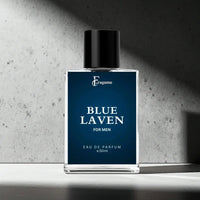 Fragume Blue Laven Eau De Parfum for men in a sleek 50ml glass bottle with a deep blue label on a concrete surface.