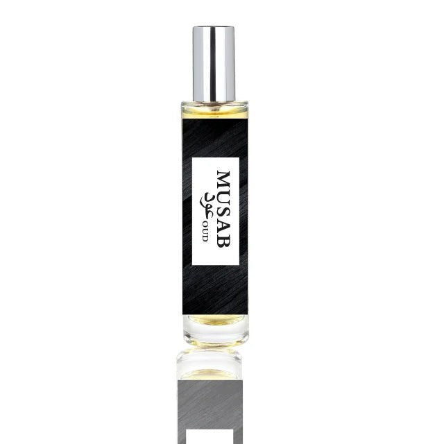 fragume Musab Oud fragrance spray in a sleek glass bottle with a black label and silver cap.