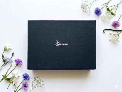 fragume 4 Pocket Perfume Set in a sleek navy blue gift box decorated with delicate white and purple flowers
