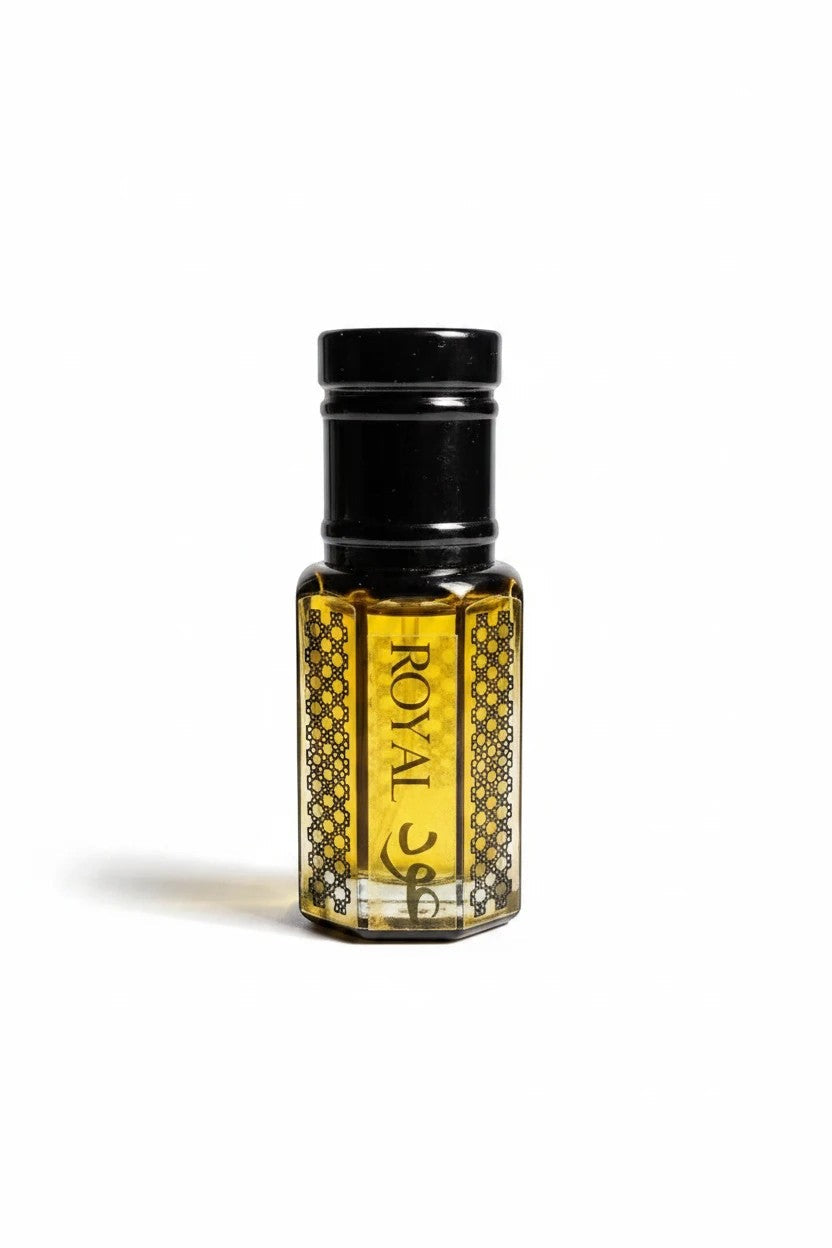 fragume Royal Oud Attar concentrated perfume oil in an elegant hexagonal glass bottle with intricate black patterns.
