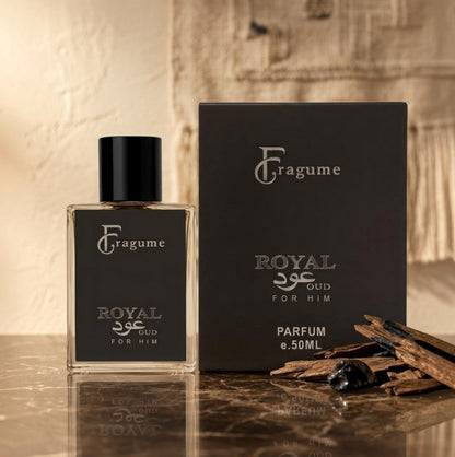 fragume Royal Oud for Him perfume bottle and box with wood chips on a marble surface